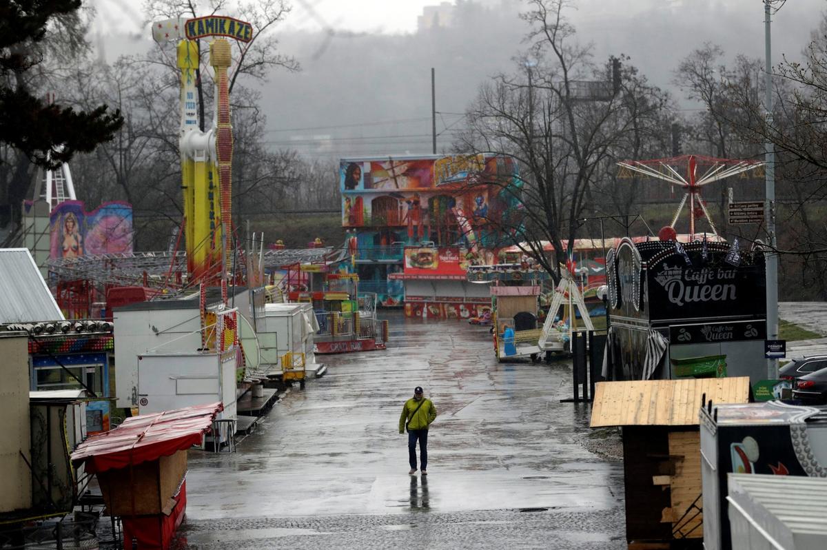 A man walks through an empty amusement park, as the Czech government bans events hosting more than 100 people to contain the spread of the new coronavirus disease (COVID-19), in Prague, Czech Republic, on March 11, 2020. (David W Cerny/Reuters)