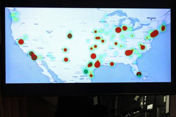 A television screen shows a heat map of the locations of the arrests the DEA carried out in its operation against a Mexican cartel operating in the United States, at the Justice Department in Washington on March 11, 2020. (Charlotte Cuthbertson/The Epoch Times)