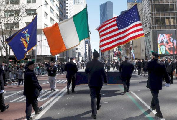 Marchers carry the New York State, Irish and America flags during the 258th St Patrick's Day Parade on 5th Avenue in Manhattan in New York City, on March 16, 2019. (Reuters/Mike Segar)