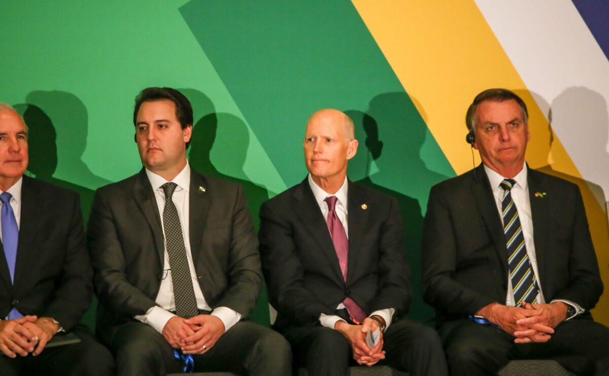 Brazilian President Jair Bolsonaro, right, sits next to Sen. Rick Scott (R-Fla.), at the Brazil-USA Business Relations Seminar in Florida at the Hilton Miami Downtown, in Miami, Florida on March 9, 2020. (Zak Bennett/AFP via Getty Images)