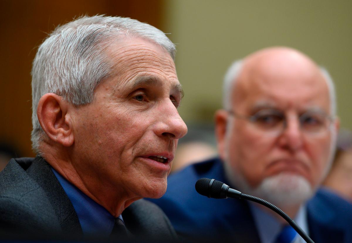 Dr. Anthony Fauci, director of the National Institute of Allergy and Infectious Diseases at National Institutes of Health, left, speaks as Dr. Robert Redfield, director of the Centers for Disease Control and Prevention looks on during a House Oversight And Reform Committee hearing concerning government preparedness and response to the coronavirus, in the Rayburn House Office Building on Capitol Hill in Washington on March 11, 2020. (Andrew Caballero-Reynolds/AFP via Getty Images)
