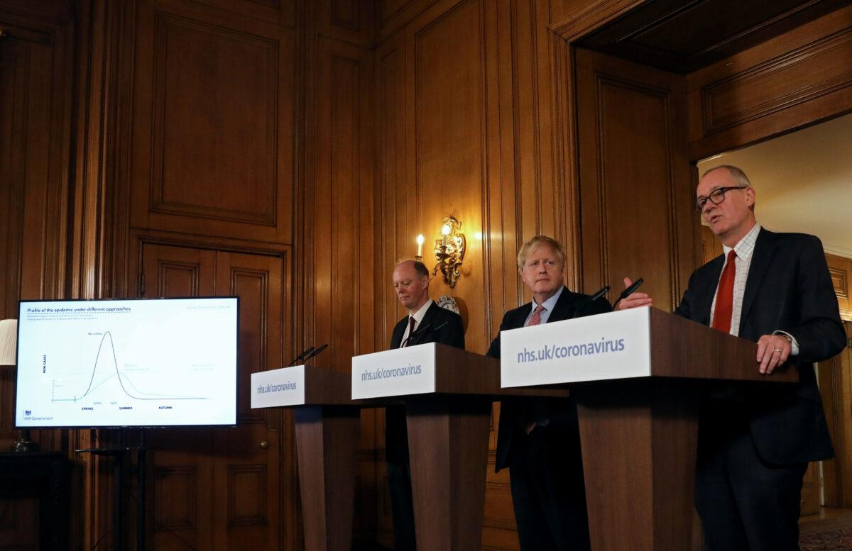 British Prime Minister Boris Johnson, Chief Medical Officer for England, Chris Whitty and Government Chief Scientific Adviser, Sir Patrick Vallance attend a news conference addressing the government's response to the coronavirus outbreak, at Downing Street in London, Britain March 12, 2020. (Simon Dawson/Pool/Reuters)