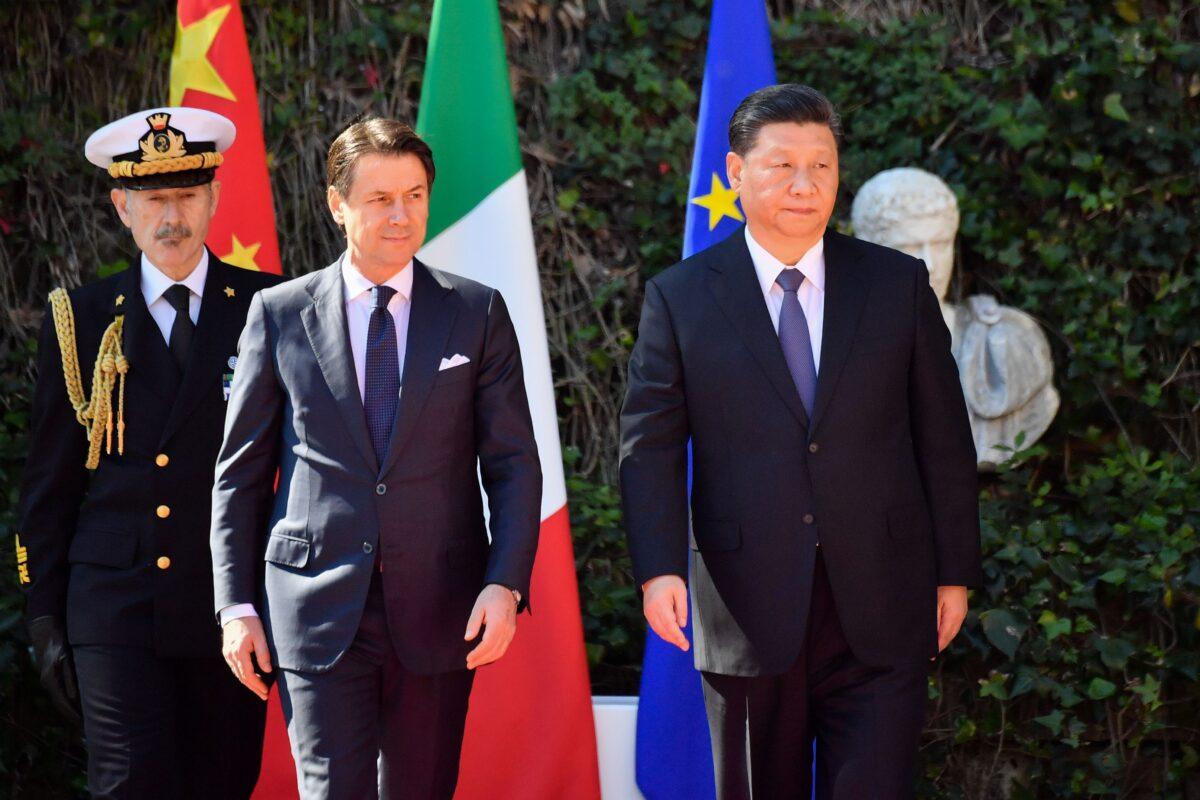 Italian Prime Minister Giuseppe Conte (2nd L) and Chinese leader Xi Jinping review Italian Carabinieri during a welcoming ceremony upon Xi's arrival for their meeting at Villa Madama in Rome on March 23, 2019. (Alberto Pizzoli/AFP via Getty Images)