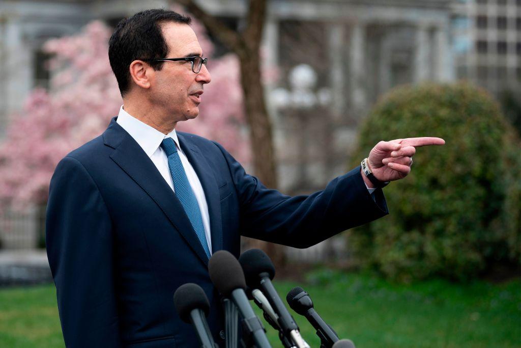 Treasury Secretary Steven Mnuchin speaks with reporters outside White House in Washington, on March 13, 2020. (Jim Watson/AFP/Getty Images)