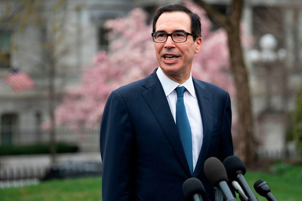 Treasury Secretary Steven Mnuchin speaks with reporters outside White House in Washington on March 13, 2020. (Jim Watson/AFP/Getty Images)