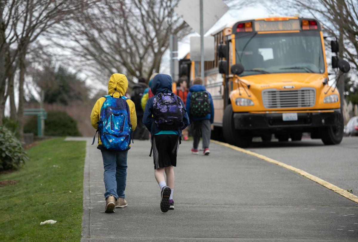Students leave the Thurgood Marshal Elementary school after the Seattle Public School system was abruptly closed due to coronavirus fears on March 11, 2020 in Seattle, Washington. (John Moore/Getty Images)