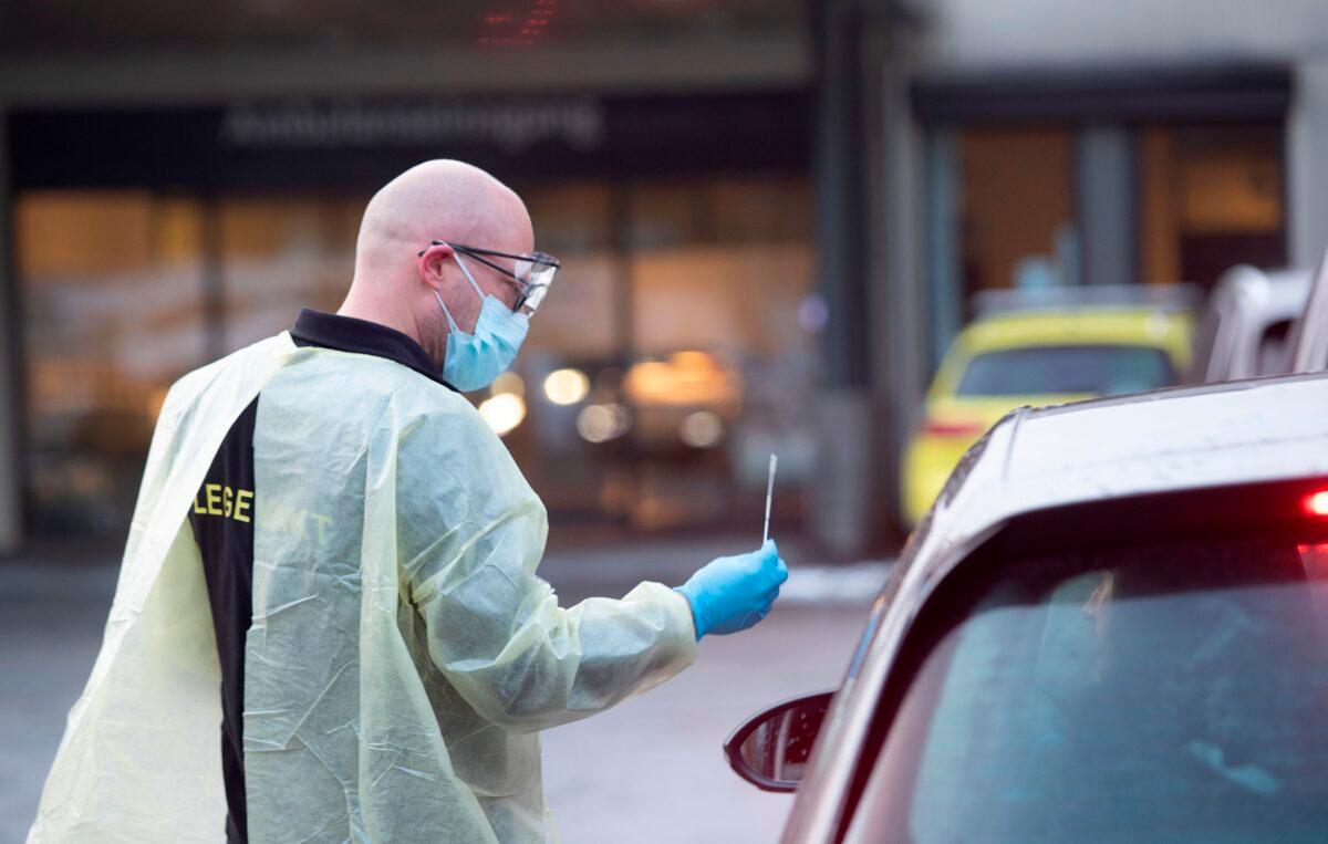 Chief doctor Germra Schneider at the emergency department in municipality Asker and Baerum tests a person for the novel coronavirus in a car outside the emergency unit in Sandvika, Norway, on March 2, 2020. (Terje Bendiksky/NTB Scanpix/AFP via Getty Images)