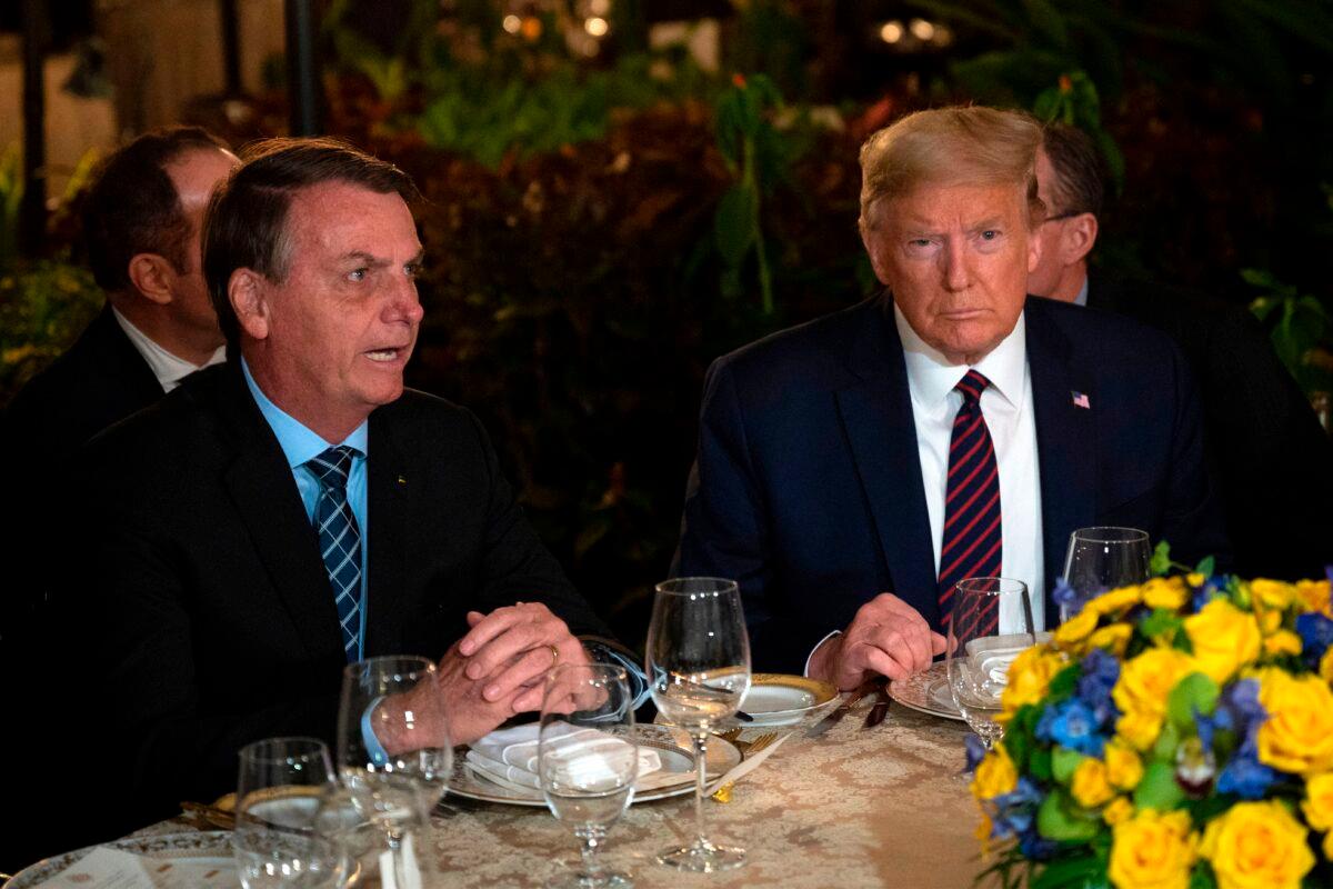 Brazilian President Jair Bolsonaro and U.S. President Donald Trump during a dinner at Mar-a-Lago in Palm Beach, Florida, on March 7, 2020. (Jim Watson/AFP via Getty Images)