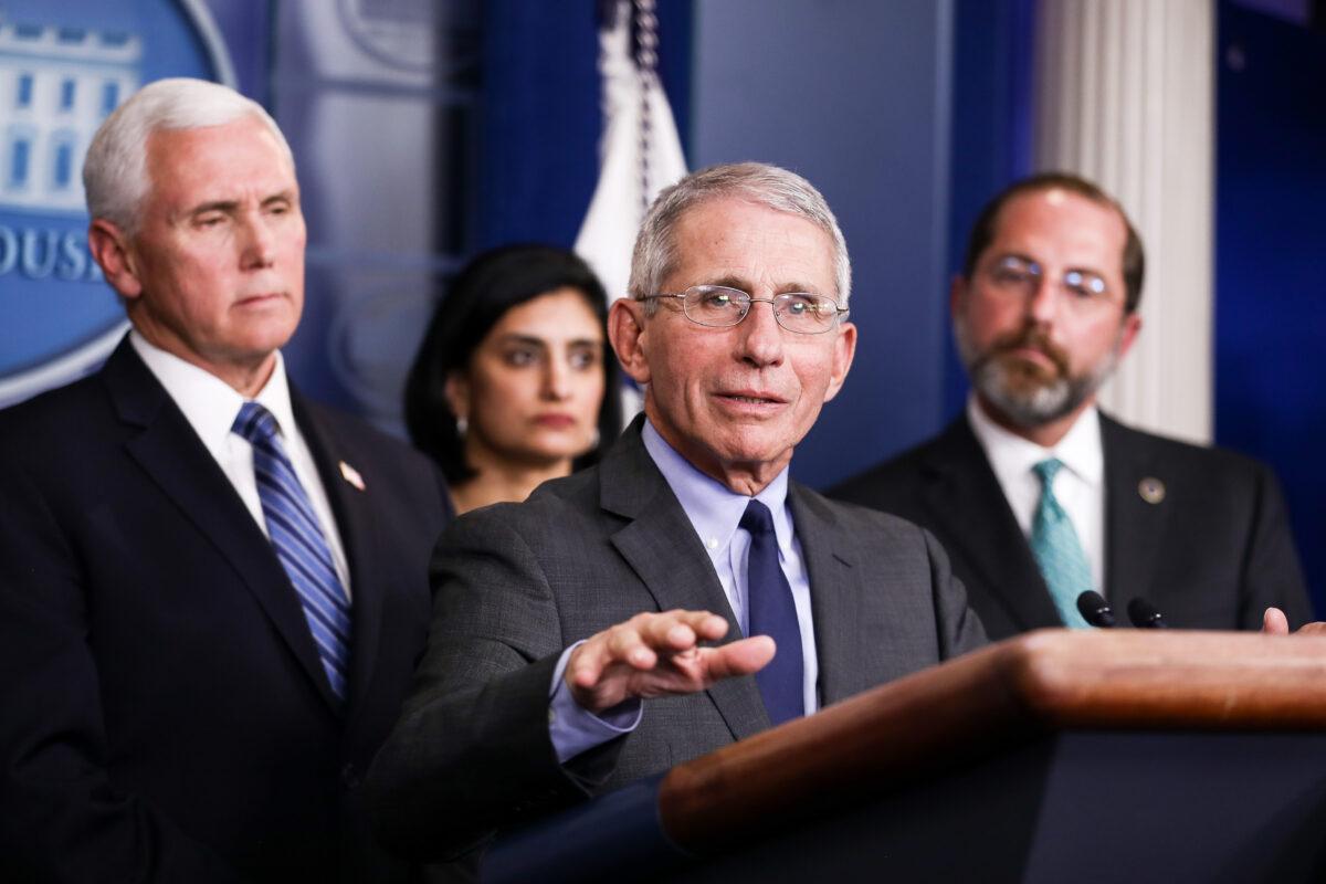 Anthony Fauci, director of the National Institute of Allergy and Infectious Diseases, answers a question during a press conference about the coronavirus as Vice President Mike Pence (L), Centers for Medicare and Medicaid Services Administrator Seema Verma (2nd L), and Health and Human Services Secretary Alex Azar (R) look on, at the White House in Washington on March 2, 2020. (Charlotte Cuthbertson/The Epoch Times)