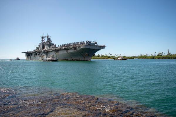 The amphibious assault ship USS Boxer (LHD 4) arrives at Joint Base Pearl Harbor-Hickam following a Western Pacific deployment, on Nov. 13, 2019. As of March 23, 2020, two sailors stationed on the ship have tested positive for the virus that caused COVID-19. (DOD/Mass Communication Specialist Seaman Aja B. Jackson)