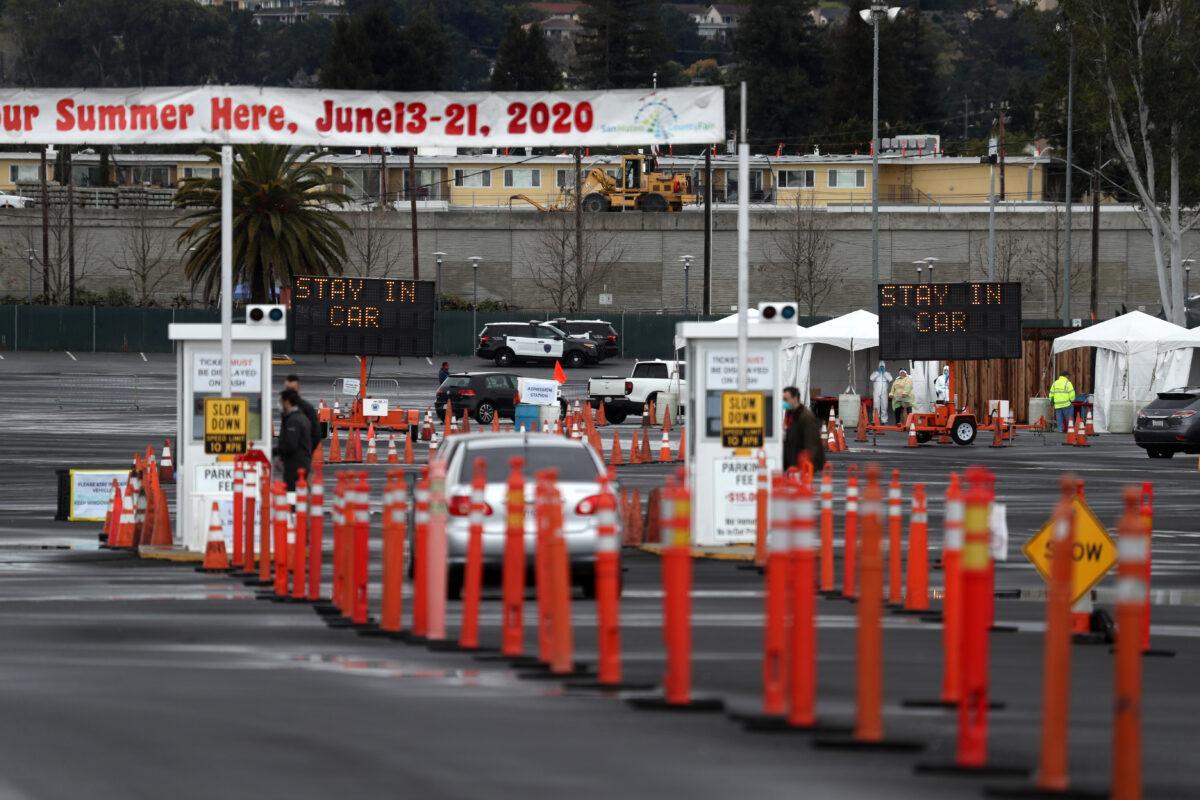 Cars line up to enter a coronavirus drive-through test clinic at the San Mateo County Event Center in San Mateo, California, on March 16, 2020. (Justin Sullivan/Getty Images)