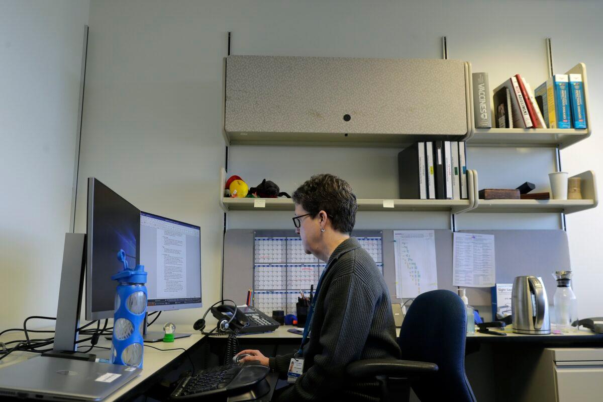 Dr. Lisa Jackson, a senior investigator at the Kaiser Permanente Washington Health Research Institute, works in her office in Seattle on March 15, 2020. (Ted S. Warren/AP Photo)
