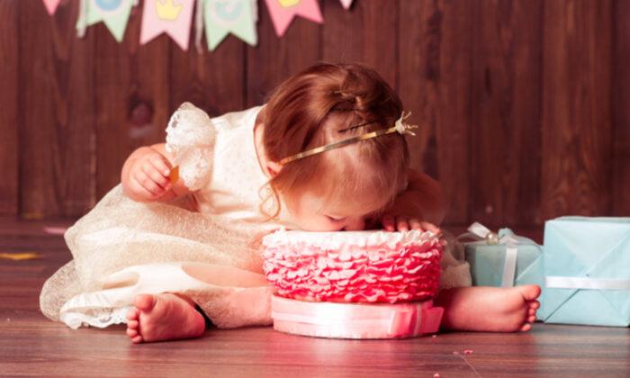 Internet Trolls Bullied Baby With Down Syndrome in Cake-Eating Video–So Her Dad Fires Back