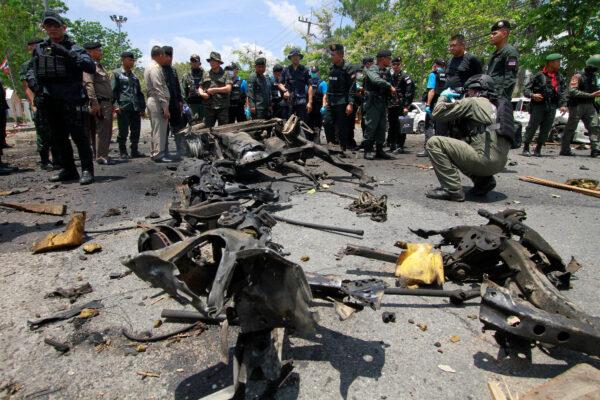 Security personnel inspect the site of a car bomb after it exploded in front of the government's Southern Border Provinces Administrative Center in Yala, Thailand, on March 17, 2020. (Surapan Boonthanom/Reuters)