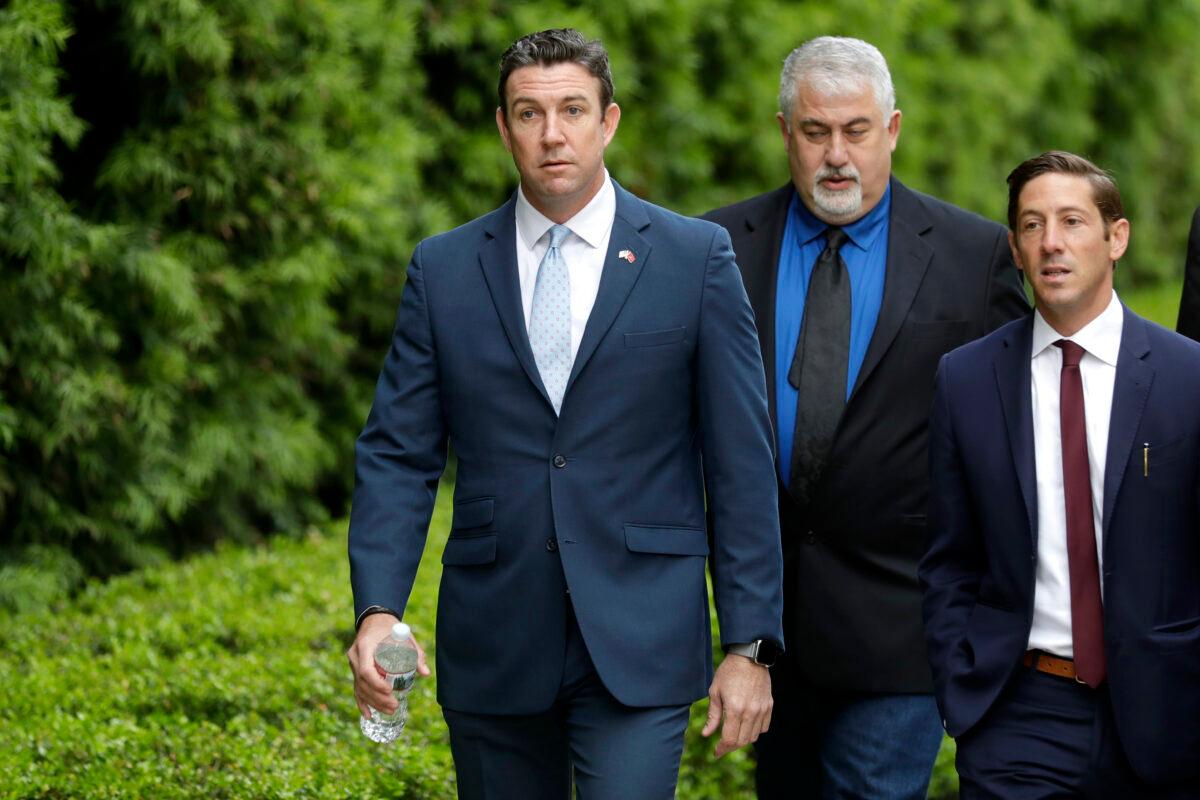 Former Rep. Duncan Hunter (R-Calif.) (L) walks towards a court building for sentencing in San Diego on March 17, 2020. (Gregory Bull/AP Photo)