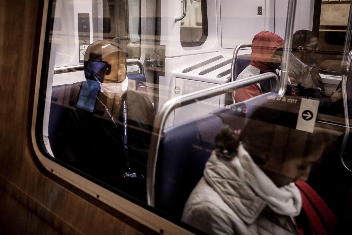 Commuters in the metro amid the coronavirus pandemic in Washington on March 16, 2020. (Samira Bouaou/The Epoch Times)
