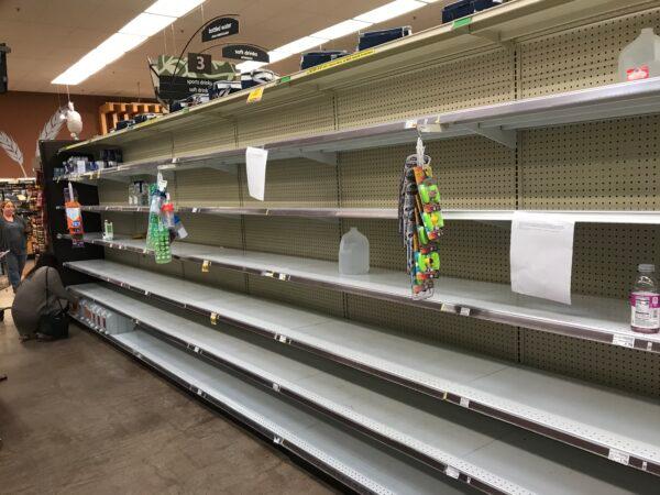 Bottled water is in short supply at Ralphs store in Menifee, Calif., on March 15. 2020. (Brad Jones/The Epoch Times)