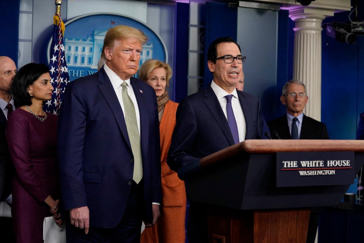 Treasury Secretary Steven Mnuchin speaks during a press briefing with the coronavirus task force as President Donald Trump looks on, at the White House, in Washington, on March 17, 2020. (Evan Vucci/AP Photo)