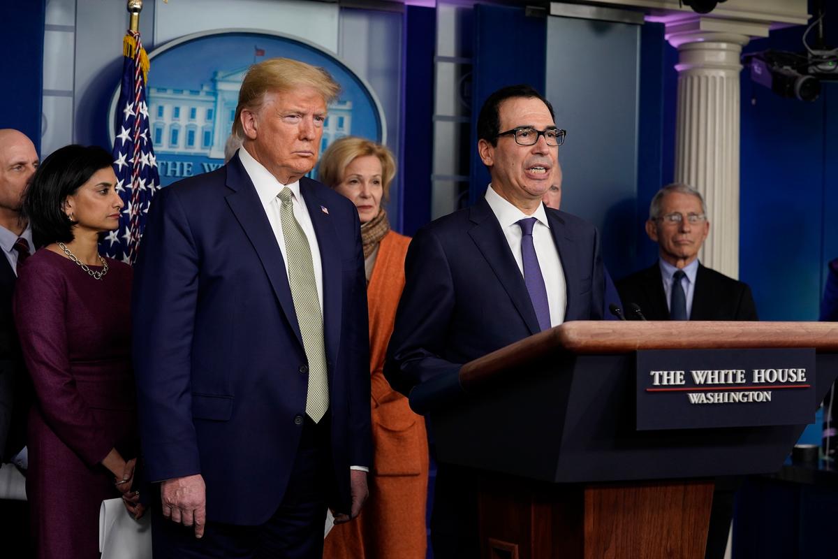 Treasury Secretary Steven Mnuchin speaks during a press briefing with the CCP virus task force as President Donald Trump looks on at the White House in Washington on March 17, 2020. (Evan Vucci/AP Photo)