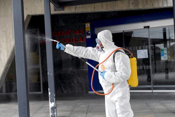 A member of the Military Emergency Unit disinfects a hospital amid the COVID-19 outbreak in Oviedo, Spain, on March 17, 2020. (Reuters/Eloy Alonso)