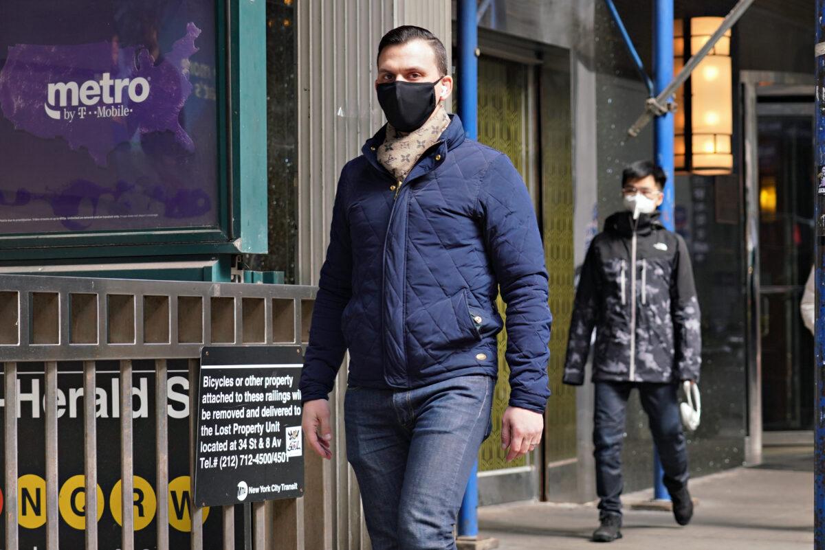 A man walks while wearing a mask as coronavirus continues to spread across the United States in New York City on March 16, 2020. (Cindy Ord/Getty Images)