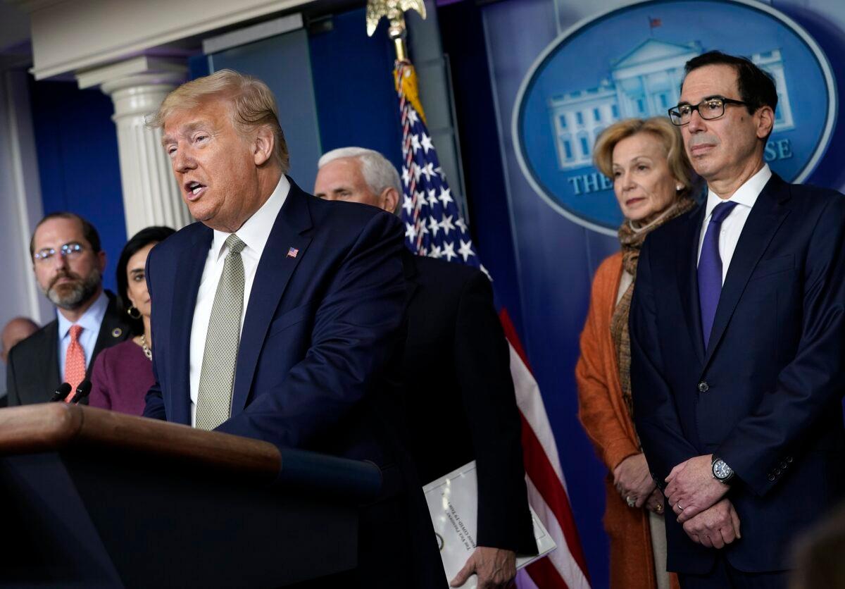 President Donald Trump speaks as administration officials listen in the press briefing room at the White House in Washington on March 17, 2020. (Drew Angerer/Getty Images)