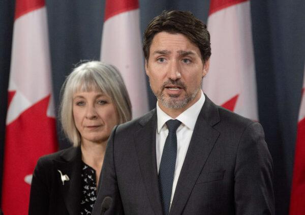 Minister of Health Patty Hajdu looks on as Prime Minister Justin Trudeau speaks during a news conference in Ottawa, Canada, on March 11, 2020. (Adrian Wyld/The Canadian Press via AP)