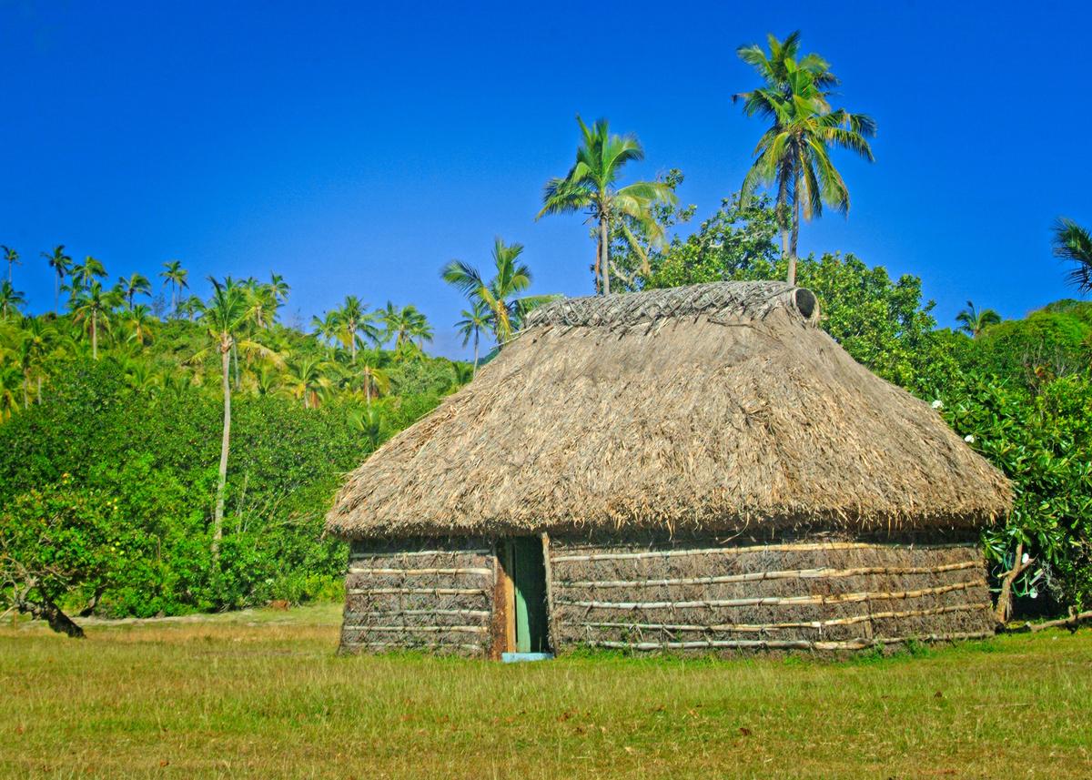 Home to many Fijians is a traditional Fijian bure, a hut usually made from local natural materials. (Copyright Fred J. Eckert)