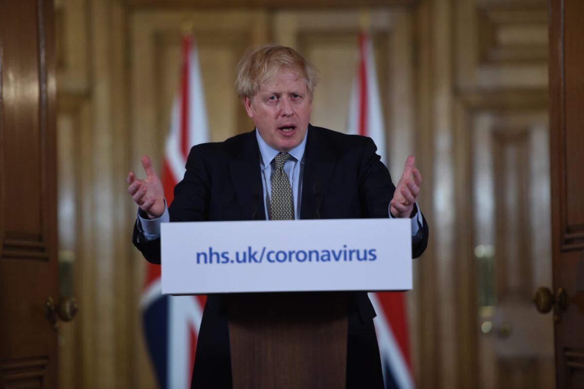 British Prime Minister Boris Johnson gestures as he gives a press conference about the ongoing situation with the COVID-19 outbreak inside 10 Downing Street on March 18, 2020 in London, England. (Eddie Mulholland/WPA Pool/Getty Images)