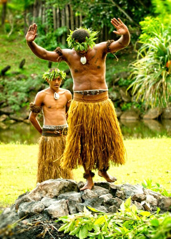 Fire-walking is a highlight at cultural shows popular with tourists in Fiji. The fire pit where these men will walk is about 12–15 feet in diameter and 3–4 feet deep. (Copyright Fred J. Eckert)