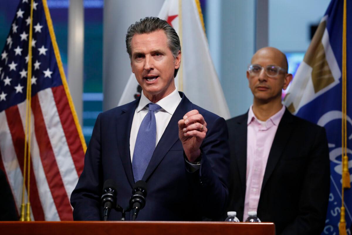California Gov. Gavin Newsom gives an update to the state's response to the coronavirus, at the Governor's Office of Emergency Services in Rancho Cordova Calif. on March 17, 2020. At right is California Health and Human Services Agency Director Dr. Mark Ghaly. (Rich Pedroncelli/AP Photo)