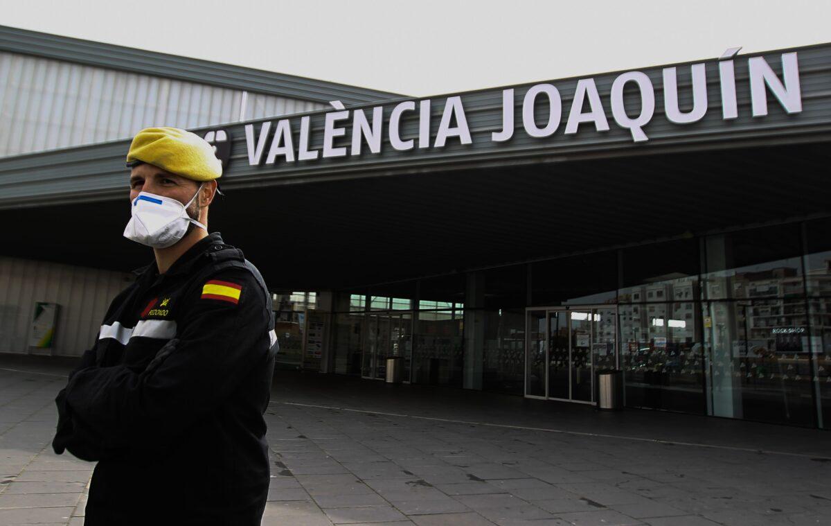 Members of the Military Emergencies Unit (UME) control access to the Joaquin Sorolla railway station in Valencia, Spain on March 18, 2020. (Jose Jordan/AFP via Getty Images)