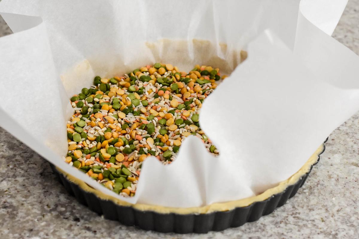 Blind bake the crust, using dried beans or pie weights so it doesn't puff up. (Audrey Le Goff)