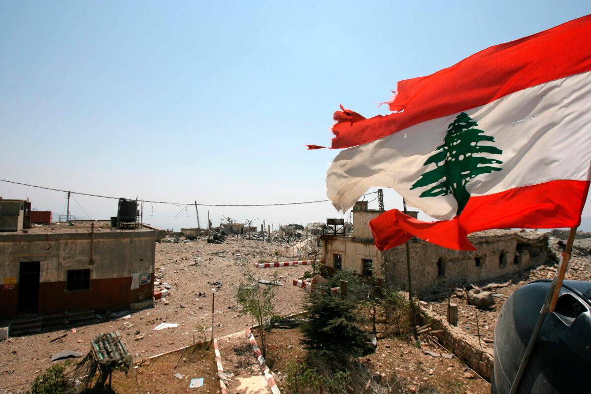 A Lebanese flag flies over Khiam prison in the southern town of Khiam, Lebanon, on Aug. 16, 2006. (Nasser Nasser/File/AP Photo)