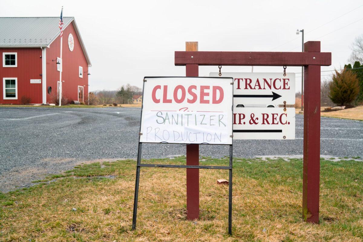 A sign announcing sanitizer production at the entrance to the Eight Oaks Farm Distillery in New Tripoli, Pennsylvania, on March 19, 2020. (Branden Eastwood/AFP via Getty Images)