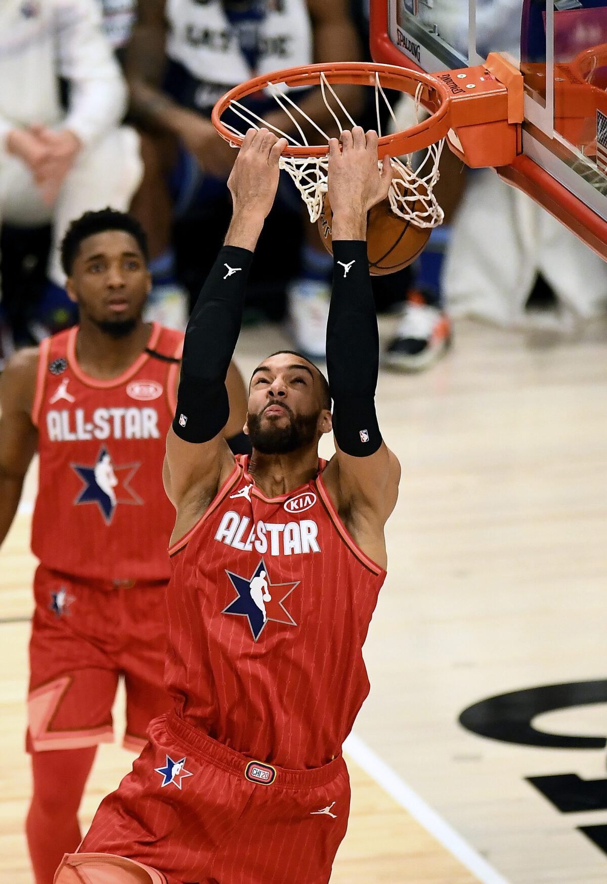 Rudy Gobert #24 of Team Giannis dunks the ball in the third quarter against Team LeBron during the 69th NBA All-Star Game at the United Center in Chicago, Illin on Feb. 16, 2020. Donovan Mitchell, background, watches. (Stacy Revere/Getty Images)