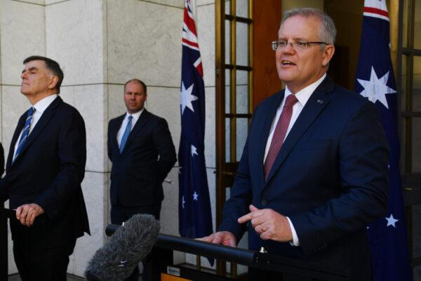 Prime Minister Scott Morrison (R), Treasurer Josh Frydenberg, and Chief Medical Officer for the Australian Government Professor Brendan Murphy (L) address the media following a Cabinet meeting at Parliament House in Canberra, Australia, on March 20, 2020. (Sam Mooy/Getty Images)