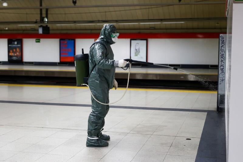 A Military Emergency Unit member disinfects Nuevos Ministerios metro station in Madrid, Spain, on March 20, 2020. (Reuters/Javier Barbancho)