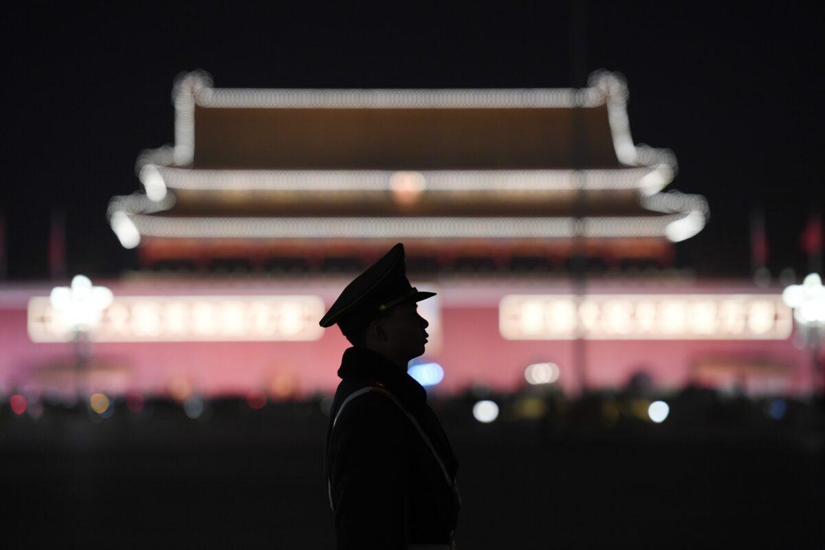 A paramilitary police officer stands guard in Tiananmen Square in Beijing on March 11, 2018. (Greg Baker/AFP via Getty Images)