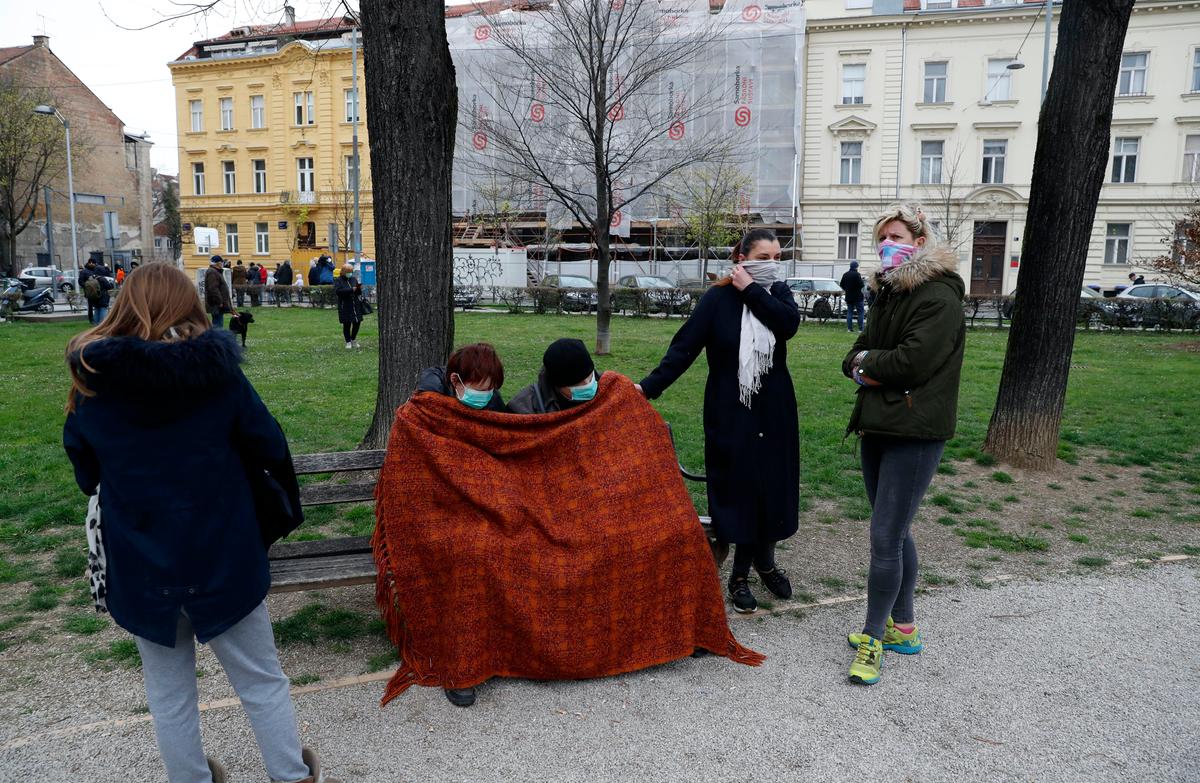 People rest in park after an earthquake in Zagreb, Croatia, on March 22, 2020. (Darko Bandic/AP Photo)