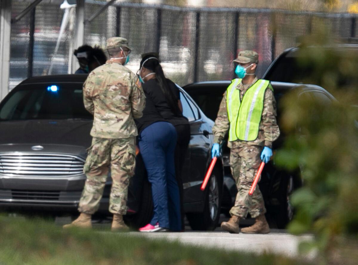 Members of Florida’s National Guard help at a coronavirus testing site they set up at C.B. Smith Park in Pembroke Pines, Fla., on March 20, 2020. (Joe Raedle/Getty Images)