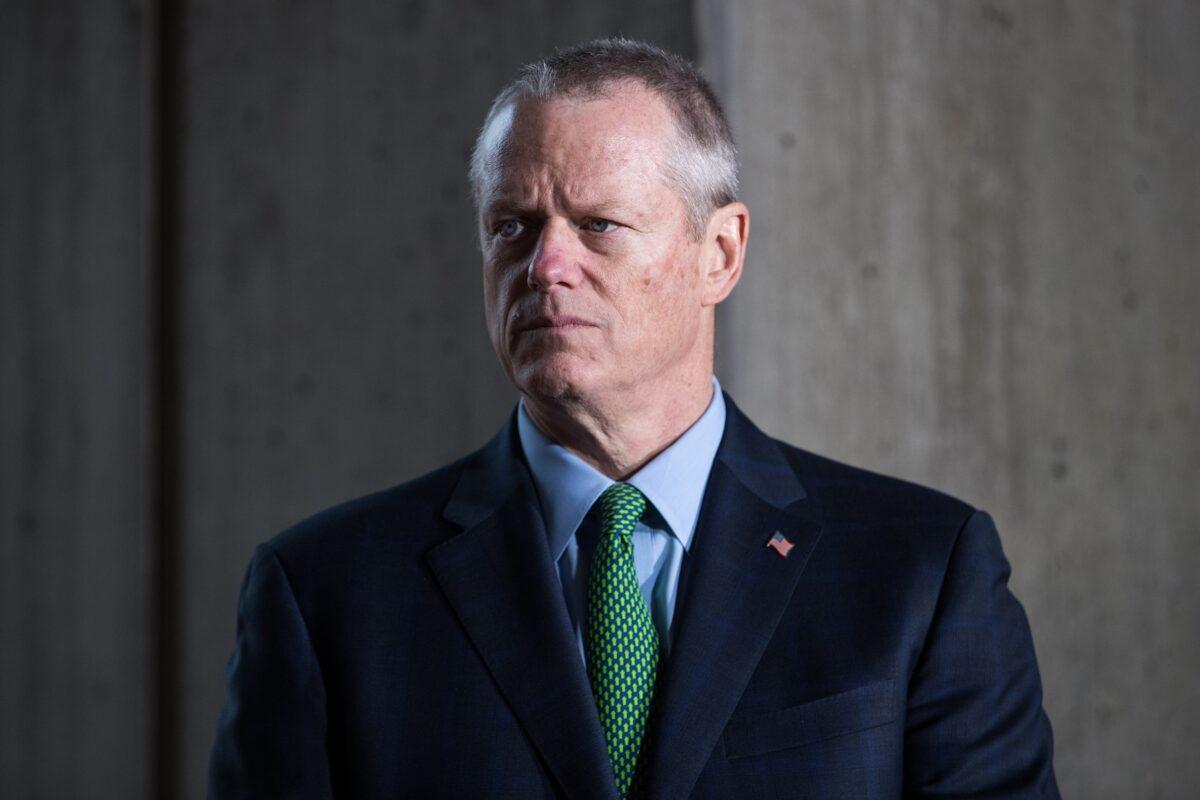 Massachusetts Governor Charlie Baker listens as Mayor Marty Walsh speaks at a press conference announcing the postponement of the Boston Marathon in Boston, Massachusetts on March 13, 2020. (Scott Eisen/Getty Images)