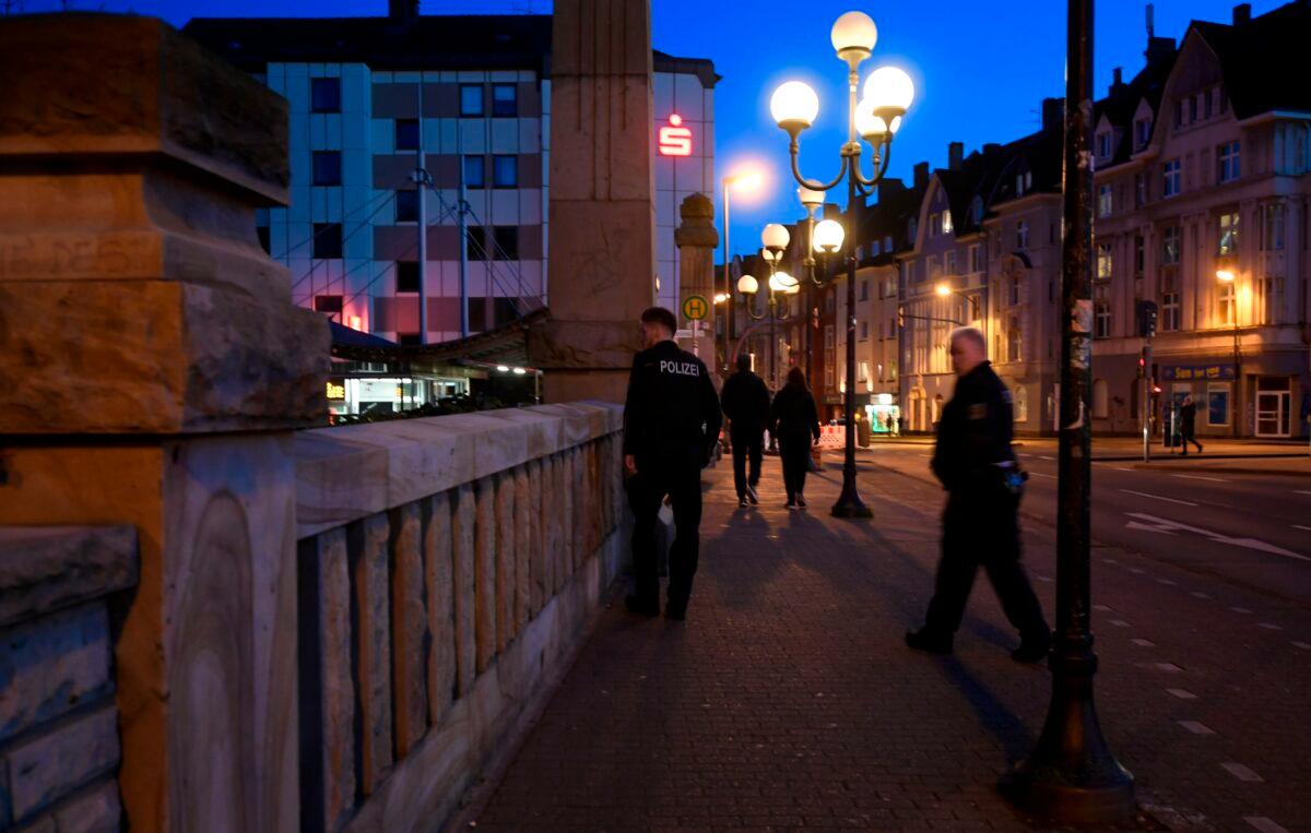 Police officers check a street in Dortmund, western Germany, on March 22, 2020 due to the spread of the novel coronavirus COVID-19. (Ina Fassbender/AFP via Getty Images)