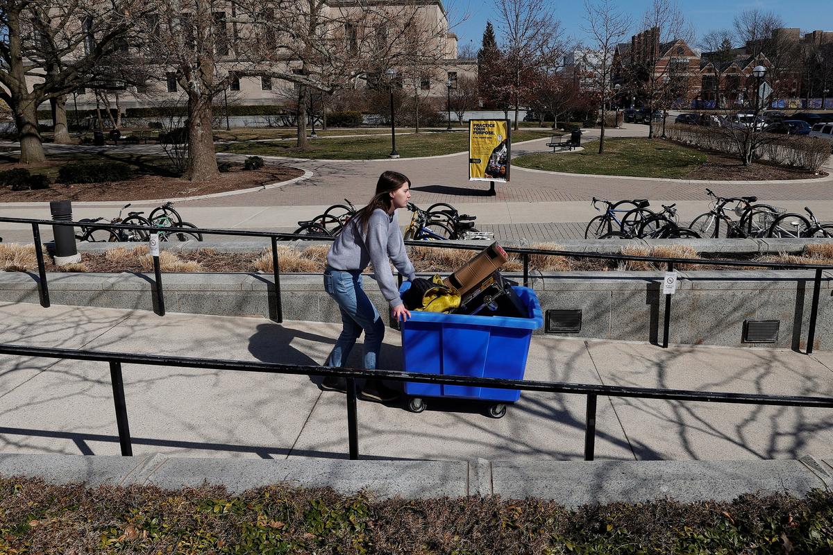 A student moves out of her dorm at the University of Michigan on March 17, 2020. (Gregory Shamus/Getty Images)