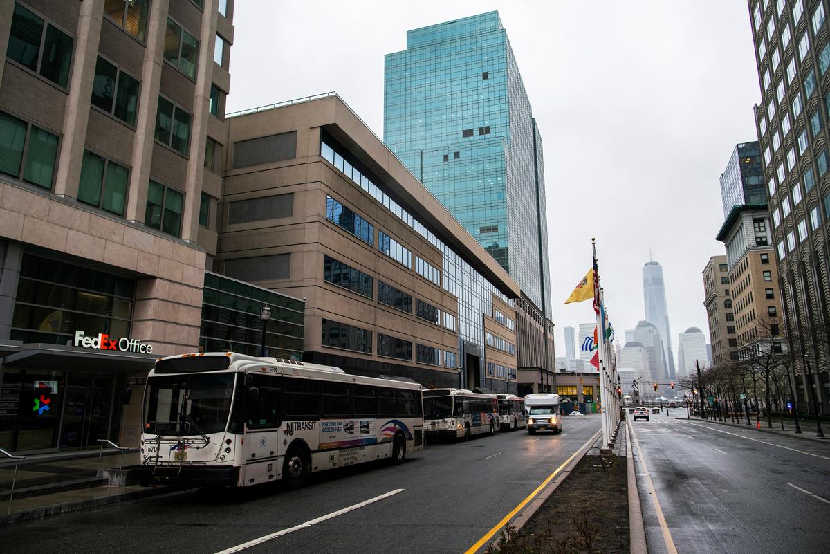 NJ Transit buses wait for people arrive to commute in Exchange Place, New Jersey, on March 23, 2020. (Eduardo Munoz Alvarez/Getty Images)
