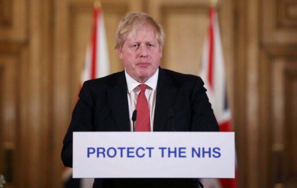 British Prime Minister Boris Johnson gives his daily COVID 19 press briefing at Downing Street in London on March 22, 2020. (Ian Vogler-WPA Pool/Getty Images)