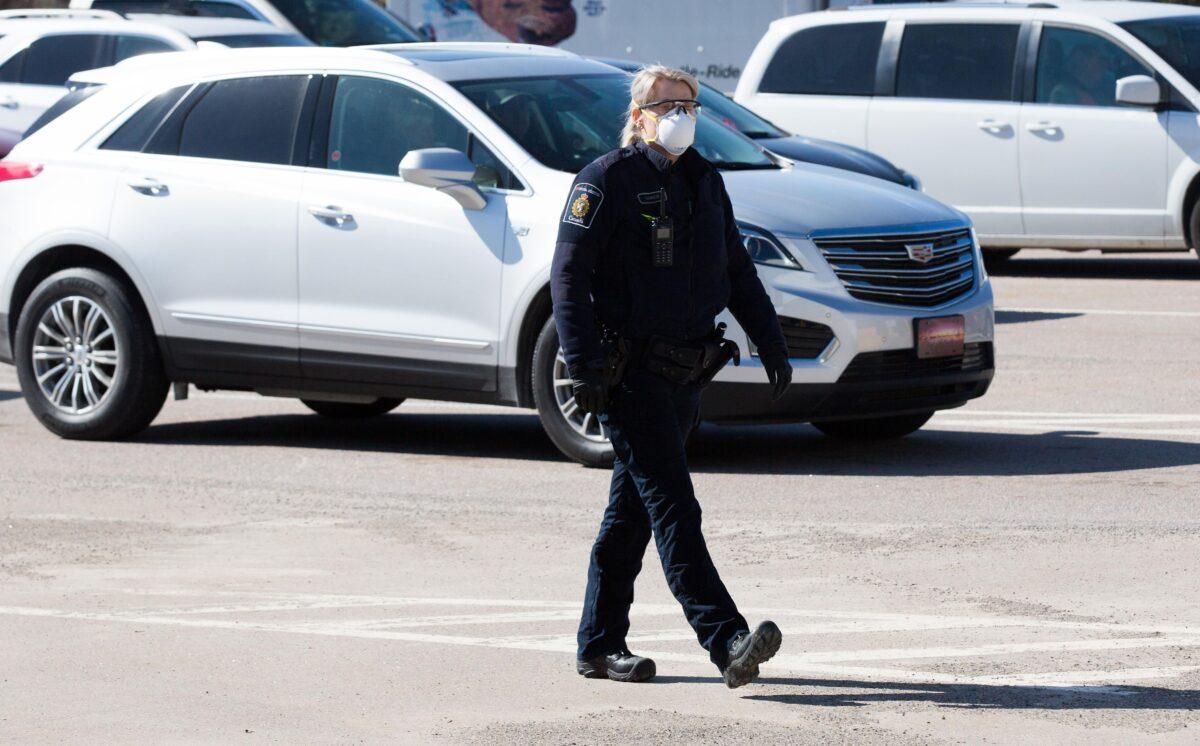 A Canadian border agent wears as face mask at the U.S./Canada border in Lansdowne, Ontario, Canada, on March 22, 2020. (Lars Hagberg/AFP via Getty Images)