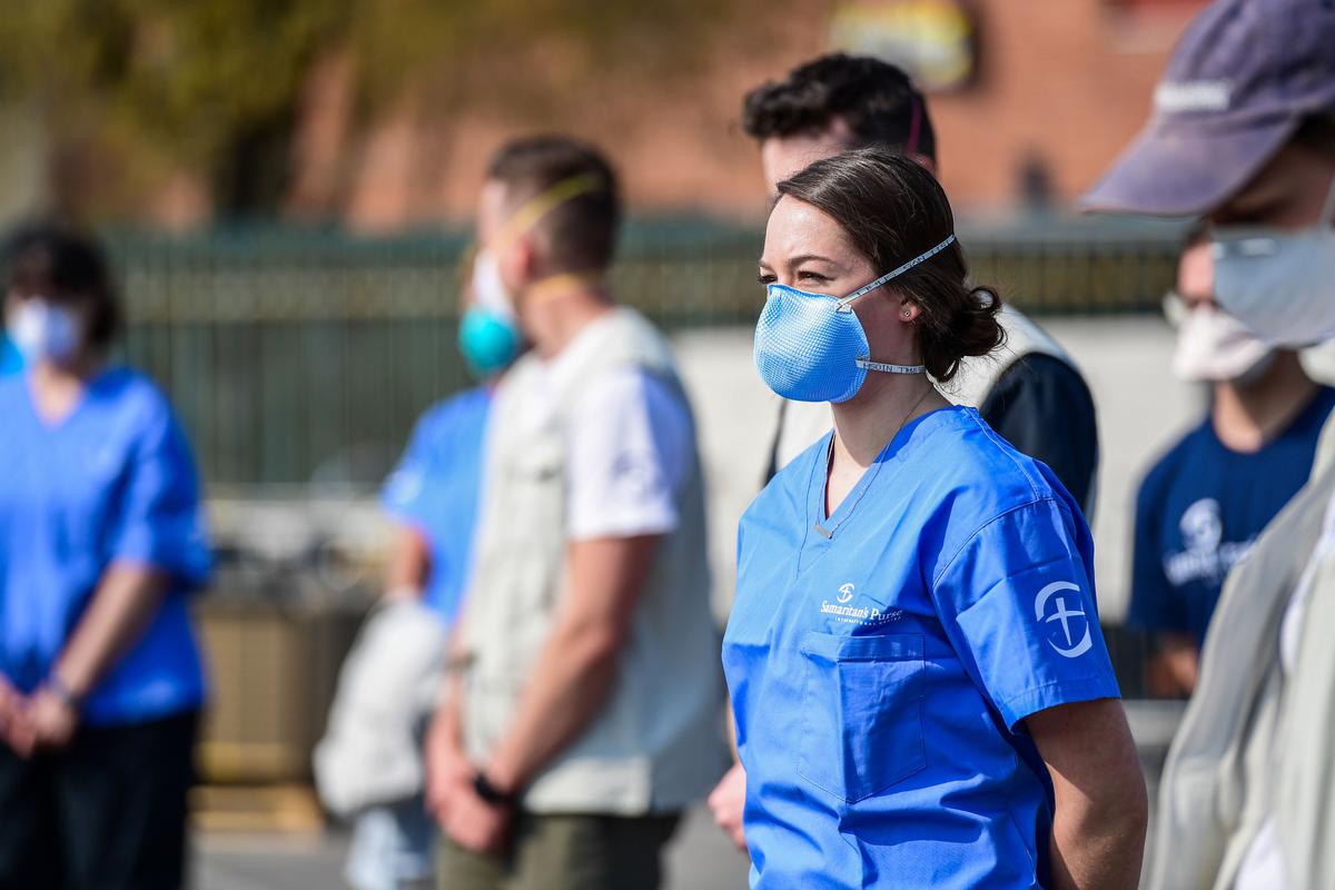 A view taken on March 20, 2020, in Cremona, southeast of Milan, shows volunteers looking on during the opening of a newly operative field hospital for coronavirus patients. (©Getty Images | <a href="https://www.gettyimages.com/detail/news-photo/view-taken-on-march-20-2020-in-cremona-southeast-of-milan-news-photo/1207747569?adppopup=true">MIGUEL MEDINA</a>)