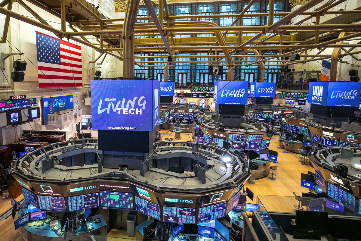 This photo provided by the New York Stock Exchange shows the unoccupied NYSE trading floor, closed temporarily for the first time in 228 years as a result of the CCP virus, on March 24, 2020. (NYSE photo by Kearney Ferguson via AP)