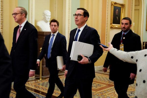 U.S. Secretary of the Treasury Steven Mnuchin walks to the meeting with Senate Minority Leader Chuck Schumer (D-NY) (not pictured) during negotiations on a coronavirus disease (COVID-19) relief package on Capitol Hill in Washington on March 23, 2020. (Joshua Roberts/Reuters)